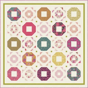 May include: A quilt with a white background and a pattern of colorful octagons with squares inside. The octagons are arranged in a grid pattern and are surrounded by a green border.