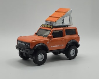1/64 Custom Ford Bronco with KMC Wheels and Roof Accessories