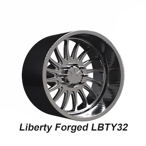 May include: A black and silver alloy wheel with a multi-spoke design. The wheel has a polished silver center and a black outer rim. The text "Liberty Forged LBT32" is displayed below the wheel.