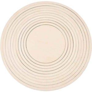 May include: A round, light-colored wooden object with concentric circles etched into its surface. The circles vary in size, creating a target-like design. The object appears to be a craft or decorative item.
