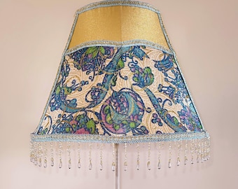 Floor lamp with a bright multicolored lampshade, for decorating the living room, for home comfort.