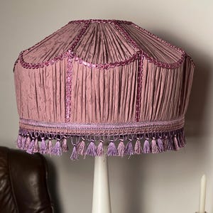 Lilac fabric lampshade with sequins and fringe, an elegant Victorian-style lampshade for an exclusive floor lamp.