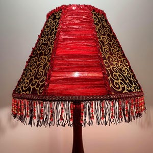 Bright red Victorian lampshade with beads for a table lamp or floor lamp, for home comfort.