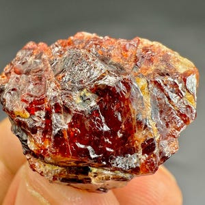 65 Carat Red Zircon Specimen: Raw Crystal Gemstone for Jewelry & Display