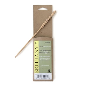 May include: A wooden crochet hook in a cardboard package. The hook is 3.5 mm (E size) and is made from sustainably harvested birch. The package says "Brittany Knitting Needles Crochet Hooks" and "Made in California".
