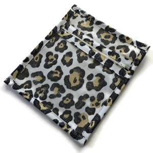 Zippered and Vinyl Small Accessory Bag in Animal Print Yellow and Black Fabric