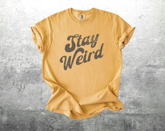 Camiseta Stay Weird, estilo retro, vintage, años 70, oversize, para mujer y hombre, colores cómodos.