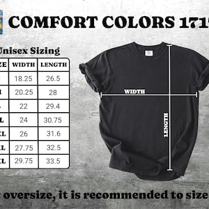 May include: Black t-shirt with a size chart and the text "COMFORT COLORS 1717". The chart shows the width and length measurements in inches for sizes S to 4XL. The text "For oversize, it is recommended to size up" is also included.