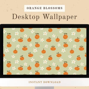 May include: A computer screen displaying a desktop wallpaper with a repeating pattern of orange blossoms and oranges on a light green background. The text "Orange Blossoms Desktop Wallpaper" is displayed at the top of the screen.