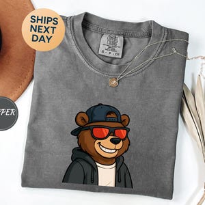 Cheerful Cartoon Bear Wearing Sunglasses and Hoodie T-Shirt,Trendy Bear Graphic Tee,Cool Animal Shirt,Funny Bear Gift,Bear Lover Gifts-PH106