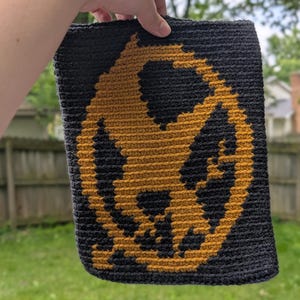 Handmade Crocheted Multicolored Pixel Image Hunger Games Inspired Mockingjay Book Sleeve
