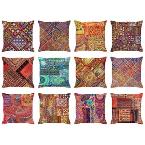 May include: Twelve colorful throw pillows with a patchwork design. The pillows are made of fabric with various textures and patterns, including embroidery and sequins. The pillows are arranged in three rows of four.