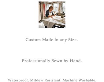 May include: A woman in an apron sews fabric at a table with a sewing machine. The text reads: "Custom Made in any Size. Professionally Sewn by Hand. Waterproof. Mildew Resistant. Machine Washable."