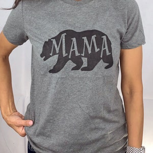 May include: Gray t-shirt with a black bear silhouette and the word "MAMA" inside the bear.