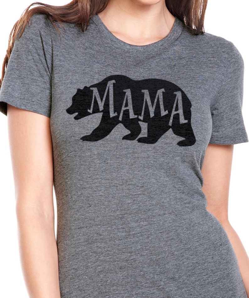 May include: A heather gray t-shirt with a black bear silhouette. The word "MAMA" is spelled out inside the bear's outline.
