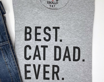 May include: A gray t-shirt with the text "BEST. CAT DAD. EVER." printed in black.