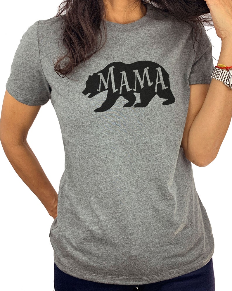 May include: Gray t-shirt with a black silhouette of a bear with the word "MAMA" inside the bear.