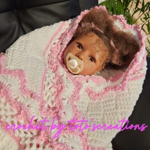Crocheted handmade White/Pink baby blanket.  An ideal baby shower gift.