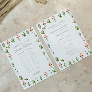 May include: Two white wedding program cards with floral and bee illustrations. The cards feature the names "Thomas & Emma" and the date "January 25, 2023." The program details the ceremony, reception, and other wedding events.