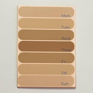 May include: A beige and brown color chart with the days of the week labeled: Mon, Tues, Wed, Thurs, Fri, Sat, Sun.