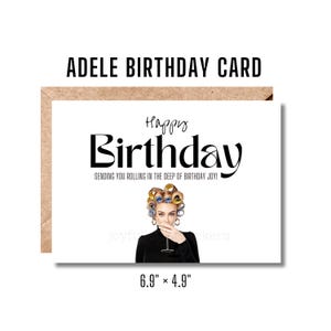 May include: A white birthday card with a black and white illustration of Adele with rollers in her hair and a glass of wine. The text "Happy Birthday" is in black cursive font and the text "Sending you rolling in the deep of birthday joy!" is in black font.