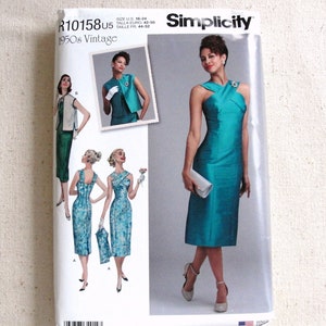 May include: Simplicity sewing pattern R10158U5 for a 1950s vintage dress. The pattern includes three different styles of dresses, all with a fitted silhouette. The dress on the front of the pattern is a teal blue color and has a criss-cross neckline.