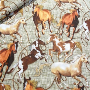 May include: Fabric with a repeating pattern of horses in various colors, including brown, white, and tan. The horses are depicted in dynamic poses, with some rearing up. The background is a light green with a rope design.