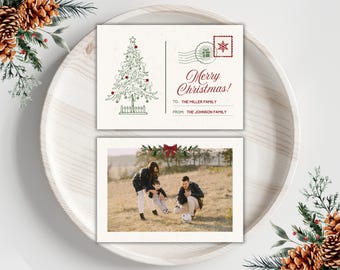May include: Christmas card with a family photo and a postcard design. The postcard features a Christmas tree illustration and the text "Merry Christmas!" with space for names. The family photo shows a family playing with a soccer ball.