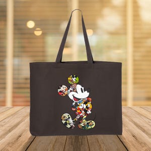 May include: A dark brown tote bag with a colourful Mickey Mouse design. The cartoon character is made up of various images of Mickey Mouse. The bag has two handles and is made of a sturdy fabric.