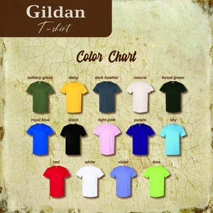 May include: Color chart showing 15 different Gildan T-shirt colors. The colors are: military green, daisy, dark heather, natural, forest green, royal blue, black, light pink, purple, sky, red, white, violet, and lime.