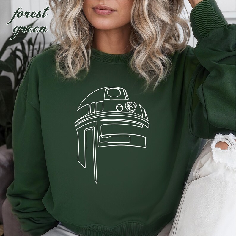 Pu&ograve; includere: Felpa verde bosco con un contorno bianco di una testa di robot.
