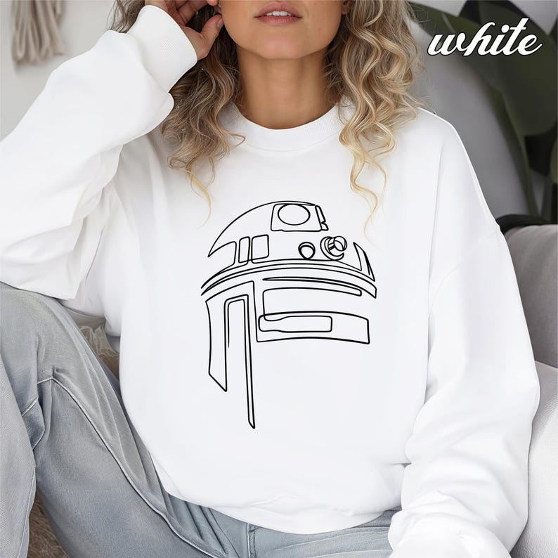 Pu&ograve; includere: Felpa bianca con un disegno a linea nera di R2-D2 di Star Wars.