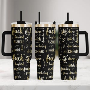 May include: Three black tumblers with handles and straws, featuring a repeating pattern of gold-colored profanity and insults in various fonts, including words like fuck, shit, bastard, asshole, bitch, douchebag, dickhead, prick, and damn.