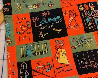 May include: Red, green, and black fabric with a repeating pattern of stylized animals, people, and geometric shapes. The fabric features a variety of scenes, including a giraffe, a lion, a person in a hat, and a person playing a drum.
