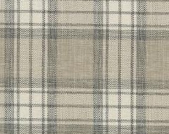 May include: A close-up of a beige and white plaid fabric. The fabric has a woven texture with a grid pattern of intersecting lines in beige, white, and gray. The pattern is symmetrical and creates a classic, neutral design.