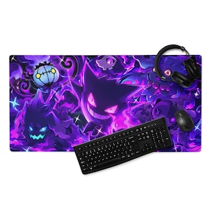 May include: A rectangular desk mat featuring a vibrant purple and black graphic print of various ghost-type creatures, including a central grinning figure. A black computer keyboard, a black computer mouse, and black headphones rest on the mat.