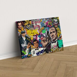 Puede incluir: Un collage colorido de im&aacute;genes de estilo pop art con un hombre con una corona, un hombre con bigote y un hombre con barba. El collage incluye las palabras "Pop Art", "The World is Yours", "Legend" y "Work Hard Dream Big".