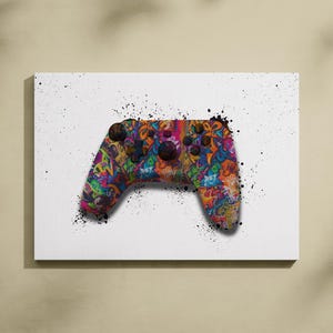 Puede incluir: Un mando de videojuego colorido con un diseño de estilo graffiti sobre un fondo blanco.