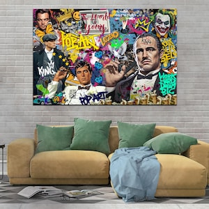 Puede incluir: Un collage de estilo pop art colorido con un hombre con traje, un hombre con sombrero y un hombre con una corona. El collage incluye las palabras "Pop Art Legend", "The World Is Yours", "King", y "Works Hard Dream Big".