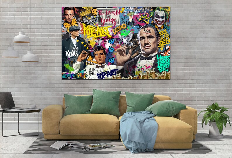 Puede incluir: Un collage de estilo pop art colorido con un hombre con traje, un hombre con sombrero y un hombre con una corona. El collage incluye las palabras "Pop Art Legend", "The World Is Yours", "King", y "Works Hard Dream Big".