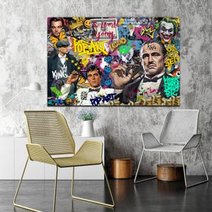 Puede incluir: Un collage de estilo pop art colorido con un hombre con traje, un hombre con sombrero, un hombre con bigote y un joker. El collage incluye las palabras "Pop Art", "King", "Legend", "The World is Yours", y "Work Hard Dream Big".