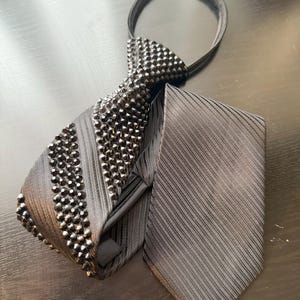 Black necktie embellished with black rhinestones crystals