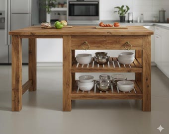 May include: A wooden kitchen island featuring a rectangular top, two drawers with circular brass pulls, and two slatted lower shelves. The shelves hold various white ceramic bowls, clear glass bowls, and stainless steel mixing bowls.