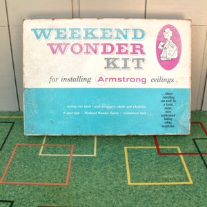 May include: A blue and white box with the text "Weekend Wonder Kit for installing Armstrong ceilings." The box contains everything you need for a faster, easier, and more professional-looking ceiling installation.