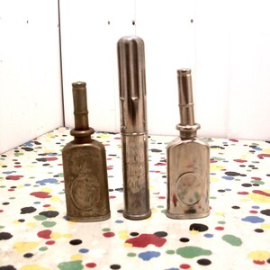 Three Vintage Metal Pocket Thumb Oilers