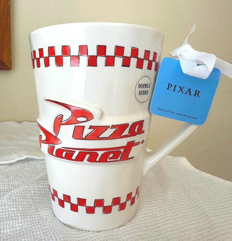 Rae Dunn Double Sided Coffee Mug - ‘Freshest In The Galaxy” Disney Toy Story Pizza Planet Checkers image 1