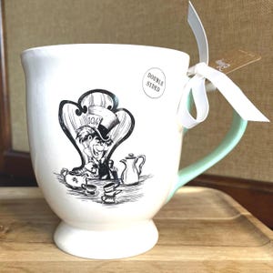 Rae Dunn x Disney Collaberation Pottery Mug- Mad As A Hatter- Alice In Wonderland Movie Character- Footed Coffee Mug