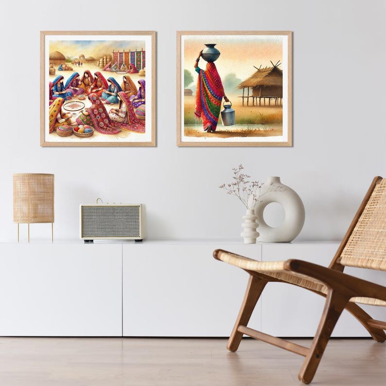 以下が含まれることがあります： インドの農村の風景を描いた水彩画2点。最初の絵は、カラフルな衣服を着た女性たちが大きな織り絨毯の周りに集まっている様子を描いており、2枚目の絵は、頭の上に水差しを載せて小屋の横を歩いている女性を描いています。