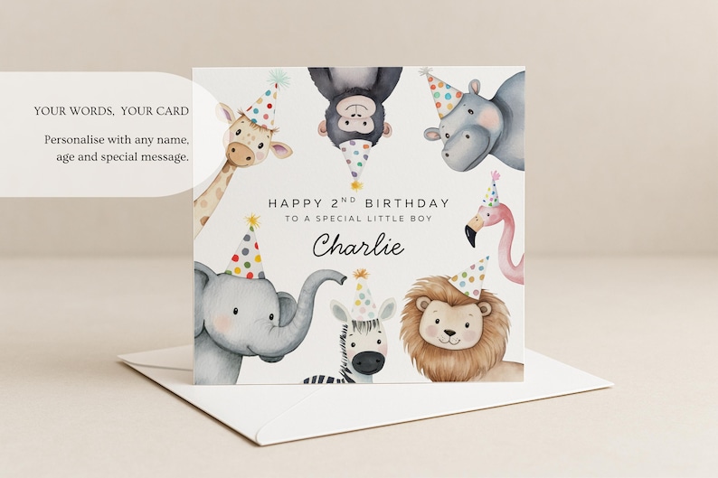 May include: A square birthday greeting card featuring watercolor illustrations of a giraffe, monkey, hippo, elephant, zebra, lion, and flamingo, all wearing colorful polka-dot party hats. The text reads: HAPPY 2ND BIRTHDAY TO A SPECIAL LITTLE BOY Charlie.