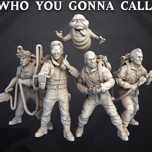 May include: Four Ghostbusters figures in white plastic, wearing proton packs and holding ghost traps. A green ghost figure is floating above them. The text "WHO YOU GONNA CALL?" is at the top of the image.